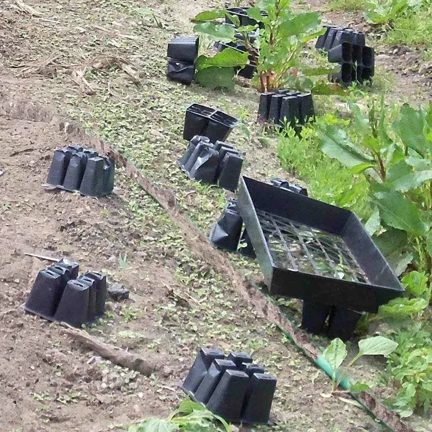 plastic pots spread around a garden