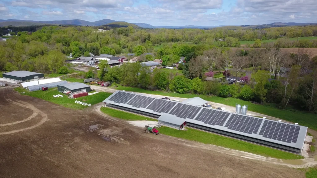 aerial view of dairy barn with solar panels