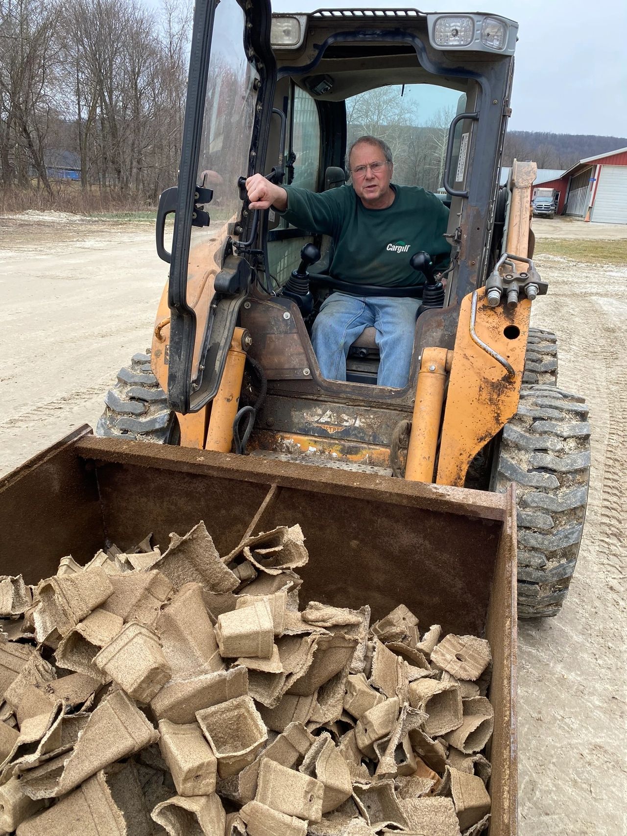 Matt collects pots for recycling on farm